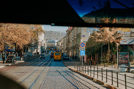 View of the streets of Lviv from tourist bus window. Travel concept. Sightseeing tour of historic ol