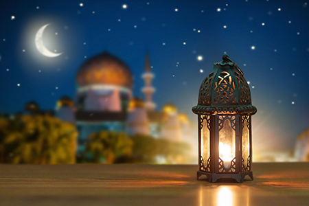 ramadan kareem greetings. Islamic lantern on night sky with crescent moon and stars. End of fasting.