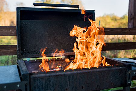 Close-up of brazier with flame of burning coals