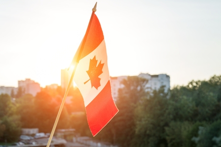 Canada flag on sunny background