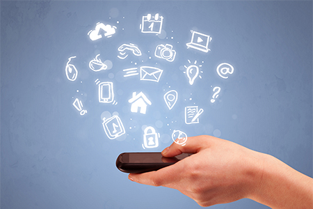 hand holding mobile phone with drawn social media icons