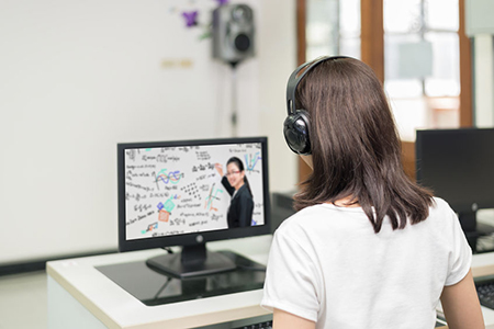 Asian woman student video conference e-learning with teacher on computer in IT room at university. E