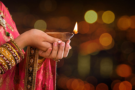 woman holding diya