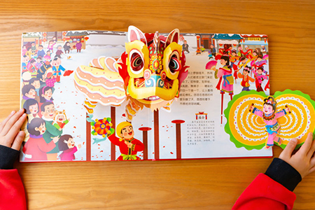 Zhongshan,China-January 26,2019:kid reading 3D books introducing cultures about Chinese new year at 