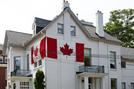 house with Canada flags on exterior walls