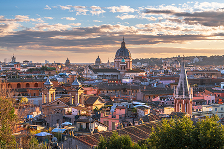 Italy, Rome cityscape with historic buildings and cathedrals at dusk