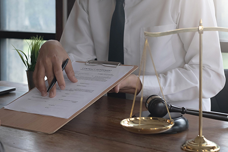 lawyer discuss the contract document with a client at law firm