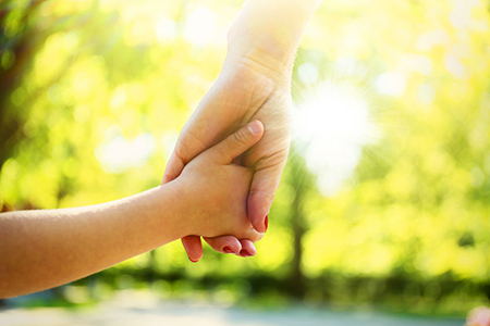 mom and daughter holding hands