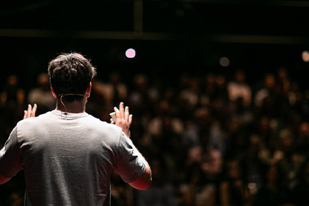 Person speaking to a crowd