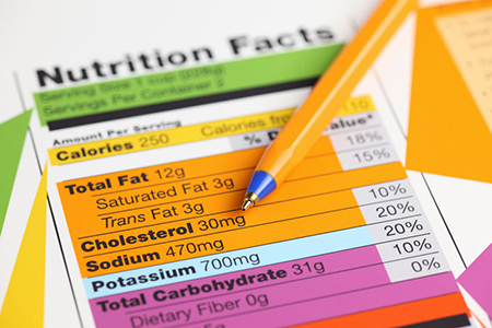 Nutrition facts and ballpoint pen. Close-up.