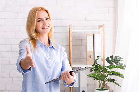 polite woman reaching for a handshake