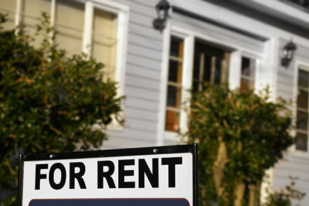 For Rent sign in front of house