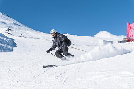 shot from behind - woman on skiis