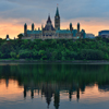 Ottawa city skyline at sunrise in the morning over river with urban historical buildings