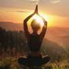 Woman practicing yoga in mountains at sunrise, back view