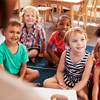 Students listening to the teacher at a daycare