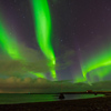 Northern lights Aurora Borealis above landscape