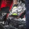 Semi Trucks Mechanic Preparing For the Work. Mechanic with Large Stainless Steel Wrench in Hand.