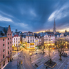 Brussels, Belgium plaza and skyline with the Town Hall tower at dusk