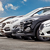 cars lined up at dealership