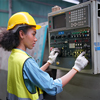 Portrait of a female apprentice in a factory