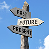 Wooden signpost - past, future, present