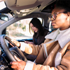 girl driving a car with a female driver examiner