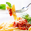 Penne pasta with bolognese sauce, parmesan cheese and basil