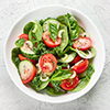 top view of fresh bright salad in white bowl