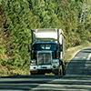 Semi truck on Highway in deep forest in Canada ontario quebec