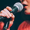 womans mouth close up near mic