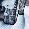 close up of car tires in snow