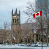 St. George's Anglican Church at Canada Square with flag - Montreal, Quebec