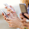 cropped image of hands holding smartphones