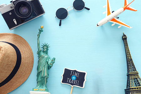 travel items - camera, hat, eiffel tower, statue of liberty