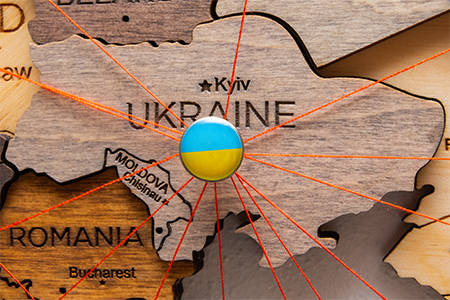 Ukraine flag pins and red thread for traveling and planning trip