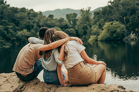 Friends in a natural lake in the forest