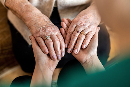 Cropped shot of a senior woman holding hands 