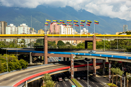 Multi level highway in center of Caracas Venezuela with national flags