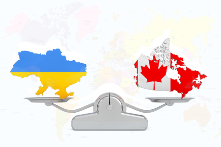 Ukraine and Canada Maps Balancing on a Simple Weighting Scale on a white background