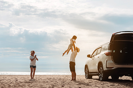 Happy Family with car travel road trip. summer vacation in car in the sunset, Dad, mom and daughter 