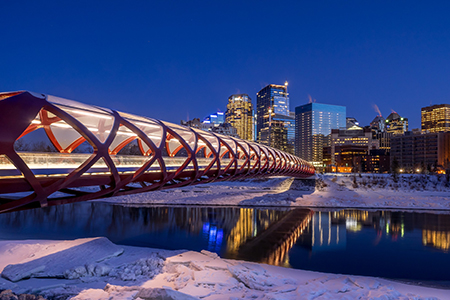 Calgary skyline at night along the Bow River in Calgary, Alberta, Canada