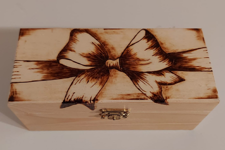 Wooden box with pyrography art - bow shape burned on to box