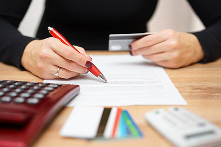 woman is opening bank account and checking credit card informations