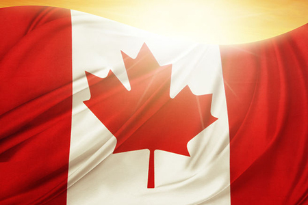 Canada flag on sunny background