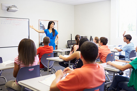 Female High School Teacher Taking Class