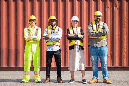 Portrait of an engineer checking products at an industrial container yard