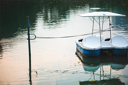 Paddle boat in a dark lake