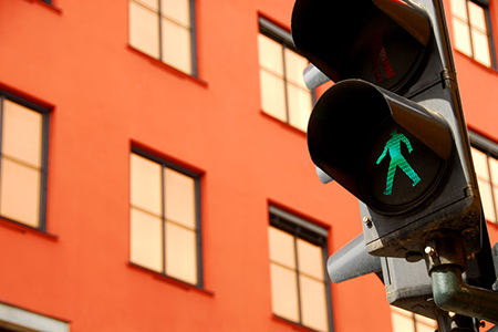 walking sign traffic light in green at city