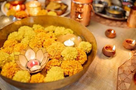 Flowers and Candles Floating in a Bowl